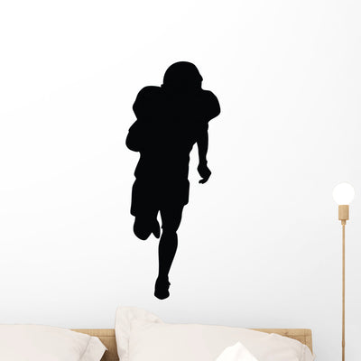 Football Silhouette Wall Decal shown on a wall