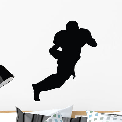 Football Silhouette Wall Decal shown on a wall