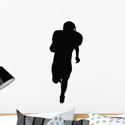 Running Back Football Silhouette Wall Decal shown on a wall