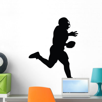 Football Silhouette Wall Decal shown on a wall