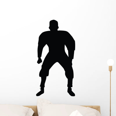 Football Silhouette Wall Decal shown on a wall