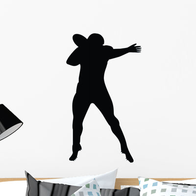 Football Silhouette Wall Decal shown on a wall