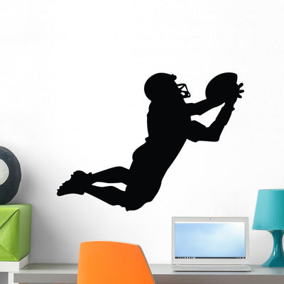 Football Silhouette Wall Decal shown on a wall