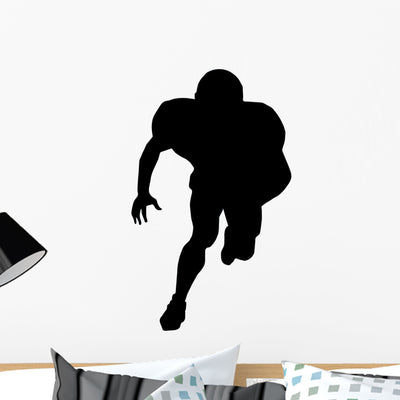 American Football Silhouette Wall Decal shown on a wall