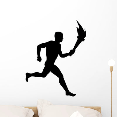 Athletic Runner Silhouette Wall Decal shown on a wall