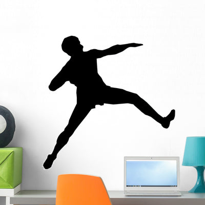 Athletic Runner Silhouette Wall Decal shown on a wall