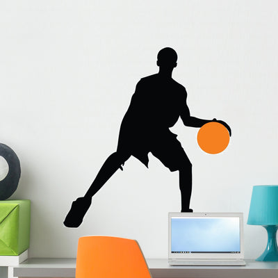 Basketball Player Silhouette Wall Decal shown on a wall