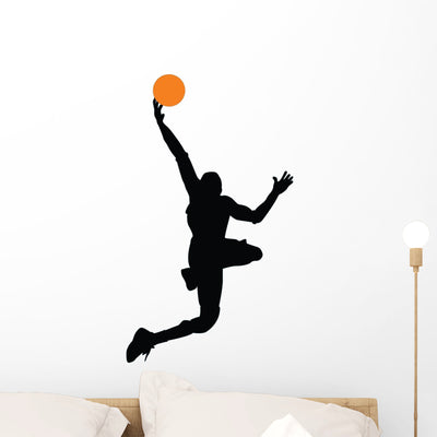 Basketball Player Silhouette Wall Decal shown on a wall