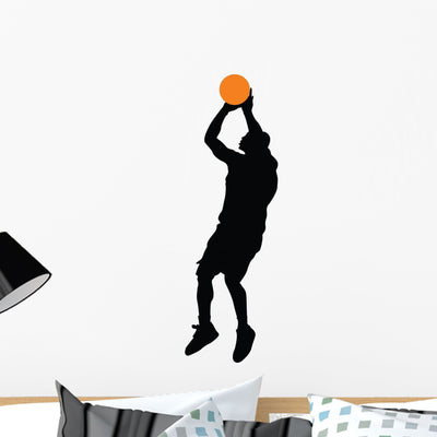 Basketball Player Silhouette Wall Decal shown on a wall