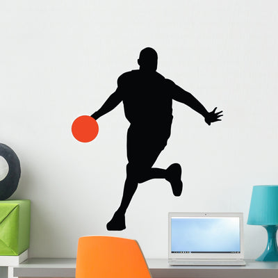 Basketball Player Silhouette Wall Decal shown on a wall