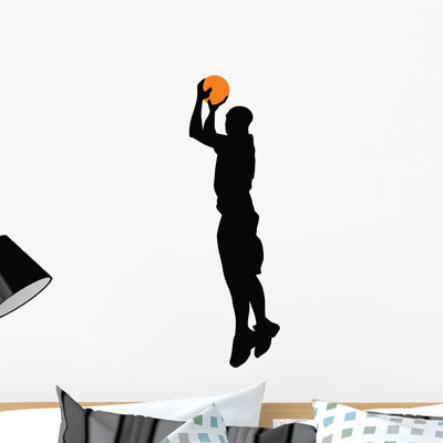 Basketball Player Silhouette Wall Decal shown on a wall