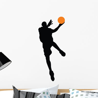 Basketball Player Silhouette Wall Decal shown on a wall
