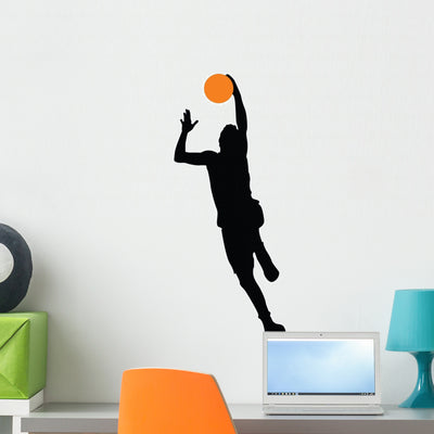 Basketball Player Silhouette Wall Decal shown on a wall