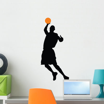 Basketball Player Silhouette Wall Decal shown on a wall