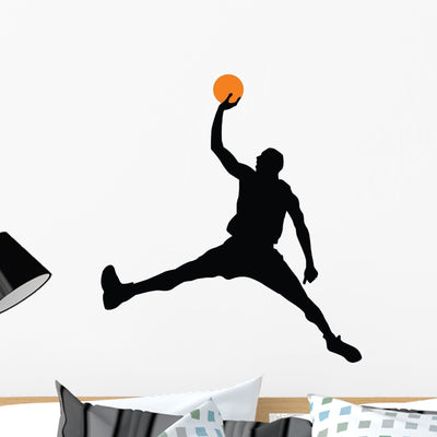 Basketball Player Silhouette Wall Decal shown on a wall