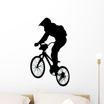 Jumping BMX Silhouette Wall Decal shown on a wall