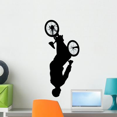 Upside-down Jump BMX Silhouette Wall Decal shown on a wall