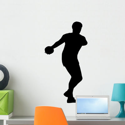 Discus Silhouettes Wall Decal shown on a wall
