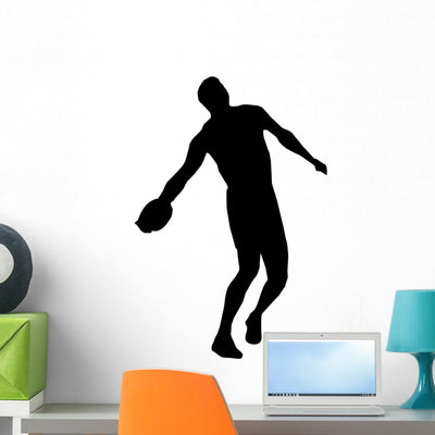 Discus Silhouettes Wall Decal shown on a wall