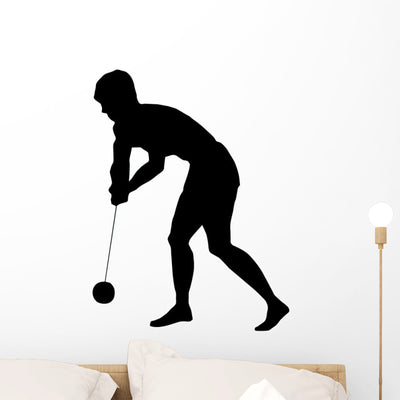 Hammer Throwing Silhouette Wall Decal shown on a wall
