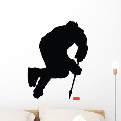 Offensive Hockey Player Wall Decal shown on a wall