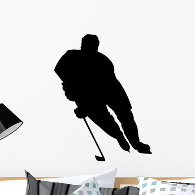 Offensive Hockey Player Silhouette Wall Decal shown on a wall