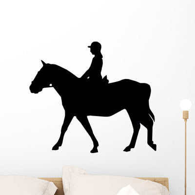 Horseback Riding Silhouette Wall Decal shown on a wall