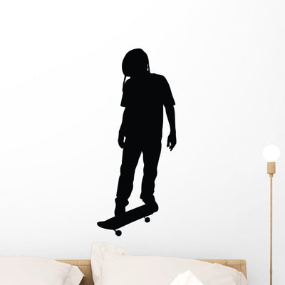 Skateboarding Silhouette Wall Decal shown on a wall