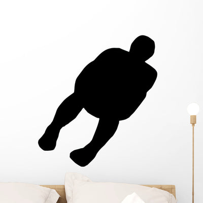 Skiing Silhouette Wall Decal shown on a wall
