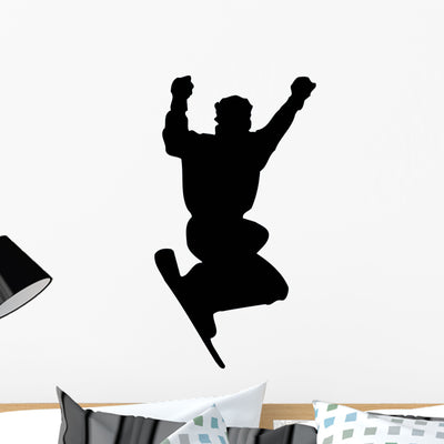 Excited Snowboard Silhouette Wall Decal shown on a wall