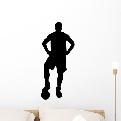 Soccer Silhouette Posing Wall Decal shown on a wall