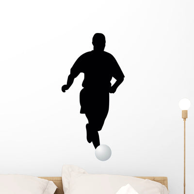 Soccer Silhouette Wall Decal shown on a wall