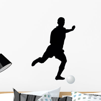 Soccer Silhouette Wall Decal shown on a wall