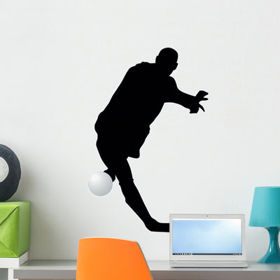 Soccer Silhouette Wall Decal shown on a wall