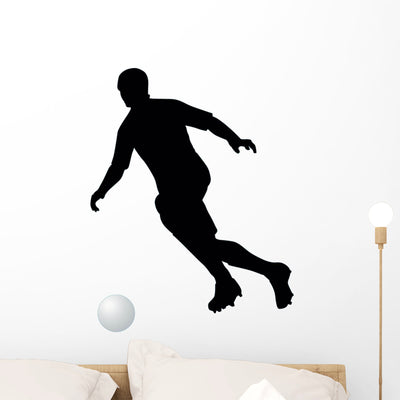 Soccer Silhouette Wall Decal shown on a wall