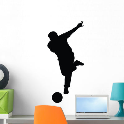 Soccer Silhouette Wall Decal shown on a wall