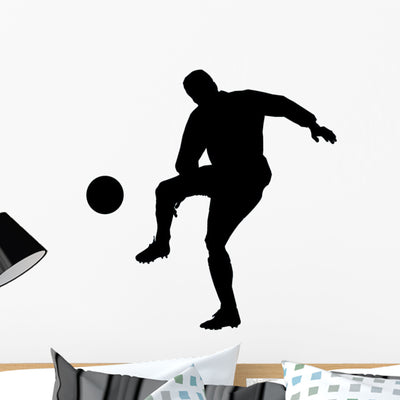 Soccer Silhouette Wall Decal shown on a wall