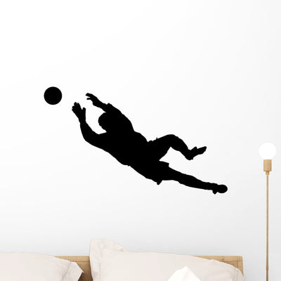 Goalie Catching Soccer Ball Wall Decal shown on a wall
