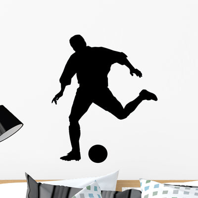 Big Kick Soccer Silhouette Wall Decal shown on a wall