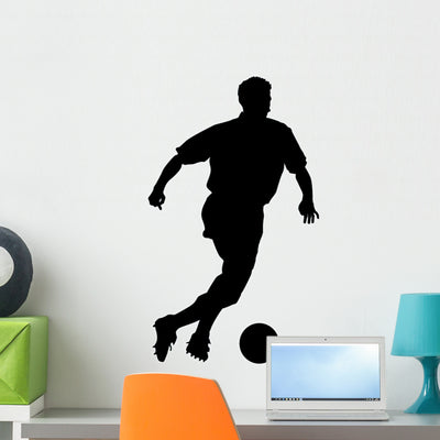 Soccer Silhouette Wall Decal shown on a wall