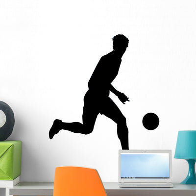 Soccer Silhouette Wall Decal shown on a wall