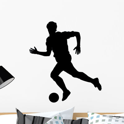 Soccer Silhouette Wall Decal shown on a wall