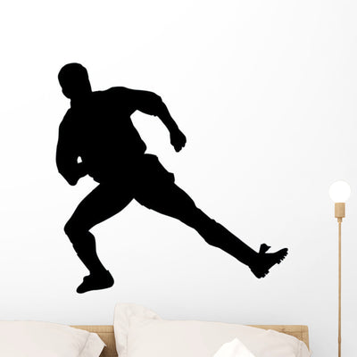 Soccer Silhouette Wall Decal shown on a wall