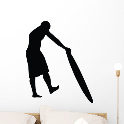 Surfing Silhouette Wall Decal shown on a wall