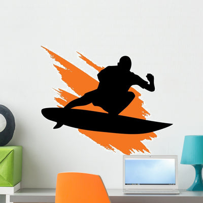 Surfing Silhouette with Orange Wall Decal shown on a wall