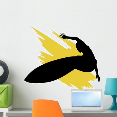 Surfer Silhouette Yellow Splash Wall Decal shown on a wall