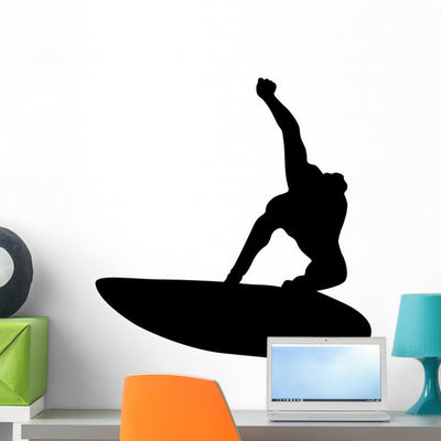 Black Surfer Silhouette Wall Decal shown on a wall