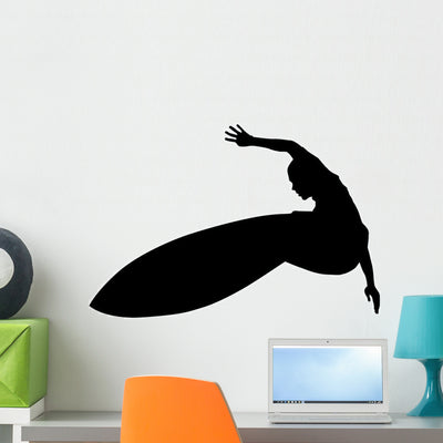 Impressive Surfer Surfing Wall Decal shown on a wall