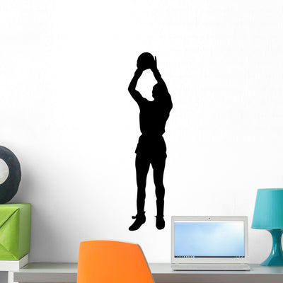 Volley Ball Silhouette Wall Decal shown on a wall