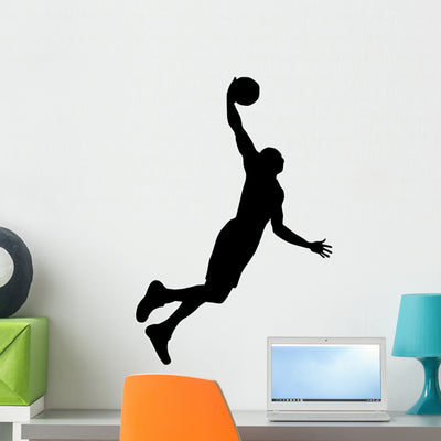 Volley Ball Silhouette Wall Decal shown on a wall
